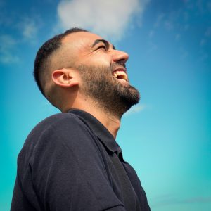 man laughing in sky