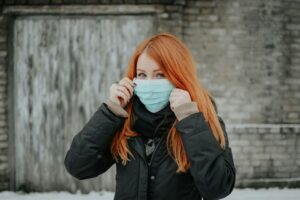 woman wearing facemask to prevent spread of illness